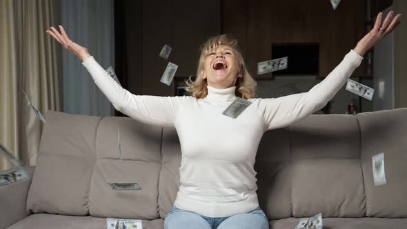 Blondehaired Dame Tosses Bills of Pension in Air Smiling