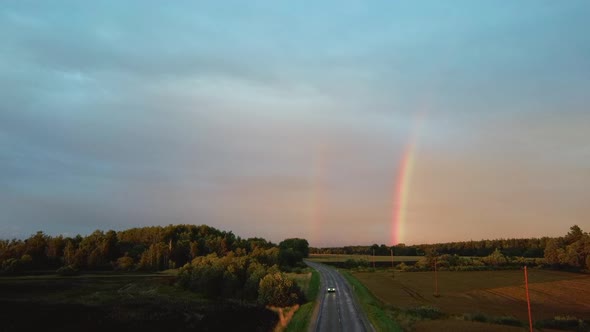 Dark Thunderstorm Clouds and Double Rainbow Over Forest and Wheat Field, Areal Dron Shoot.