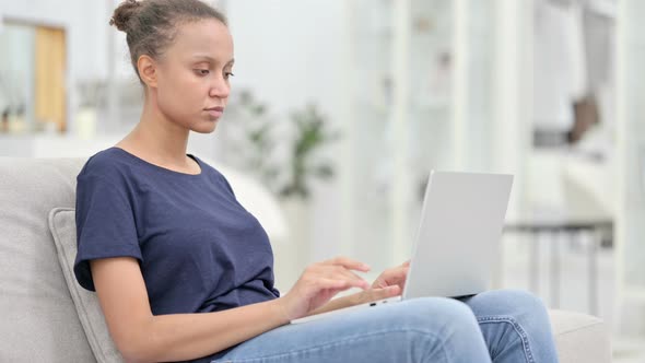 Loss, African Woman Reacting To Failure on Laptop at Home 