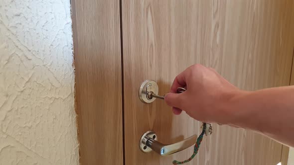 POV (point of view) locking and unlocking door. Realistic personement. Wooden door.