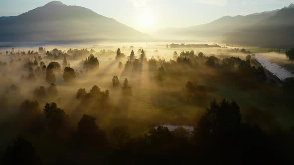 Drone Over Ethereal Misty Landscape Of Zell Am See At Sunrise