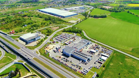 Aerial view of goods warehouse. Logistics center in industrial city zone from above. Aerial view of