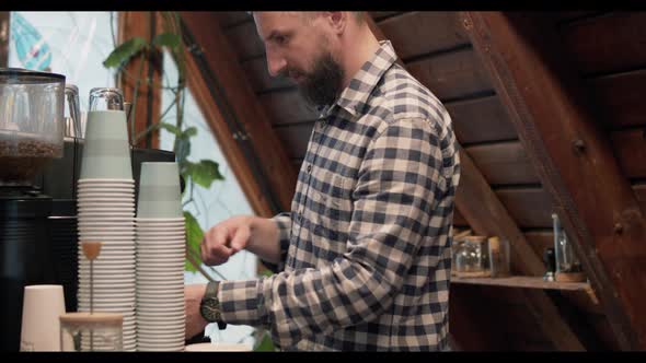 Male barista making coffee