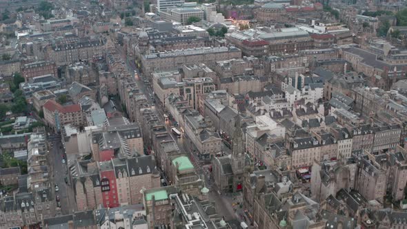 Dolly forward drone shot over Old Town towards Edinburgh University
