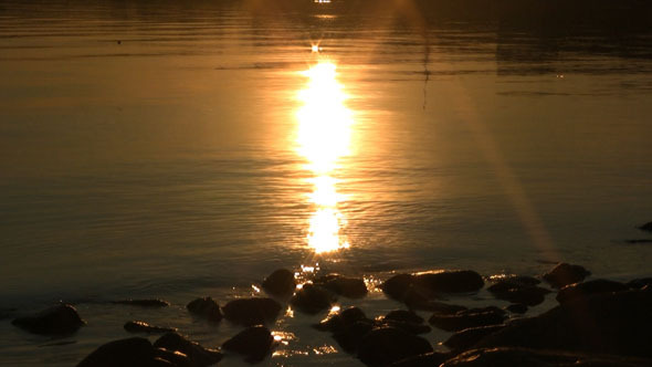Calm Sea With Sunrise Reflection
