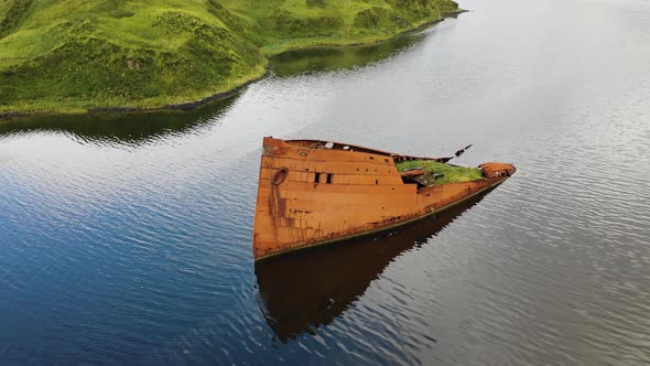 Aerial view of a shipwreck in Captain Bay in Unalaska, Alaska, United States.