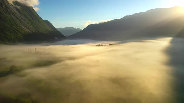 Morning Mist Over the Valley Among the Mountains in the Sunlight