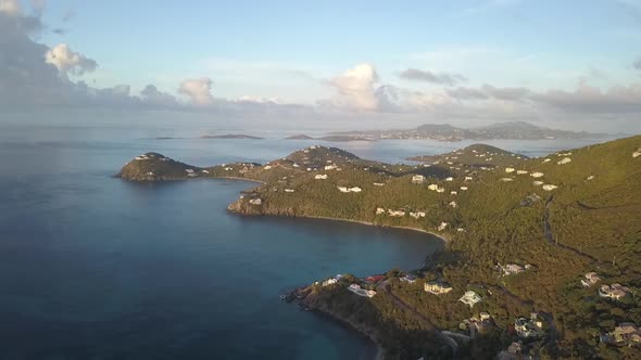 Drone Flying over St. John Caribbean Island Coast - St. Thomas in background