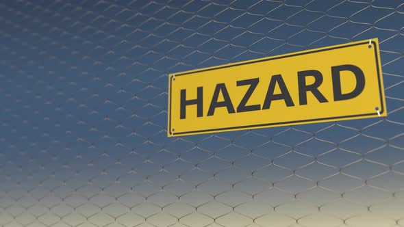 HAZARD Sign an a Meshing Wire Fence