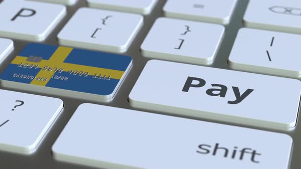 Bank Card with Flag of Sweden As a Key on a Keyboard alt