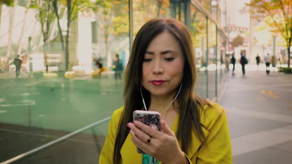 Japanese woman using her smartphone in Tokyo Japan