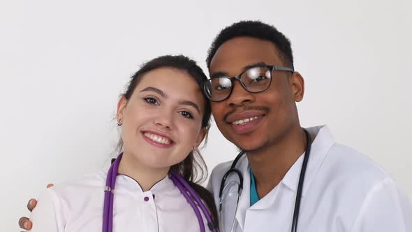 Young African doctor with a European girl of a doctor. Treatment concept.