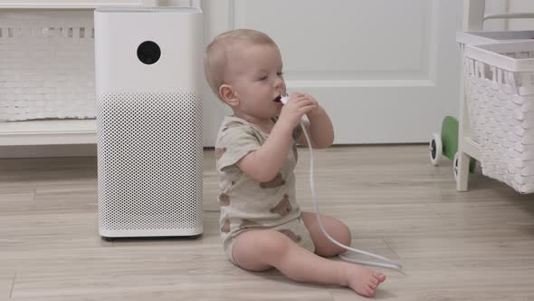 Toddler Playing with Electric Wire on Floor at Living Room 1 Year Old Infant Holding the Electric