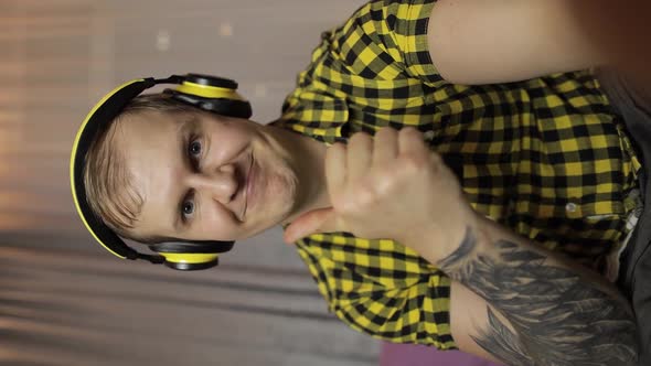 Vertical Handheld POV Shot of Young Man Making Selfie, Video Call at Home