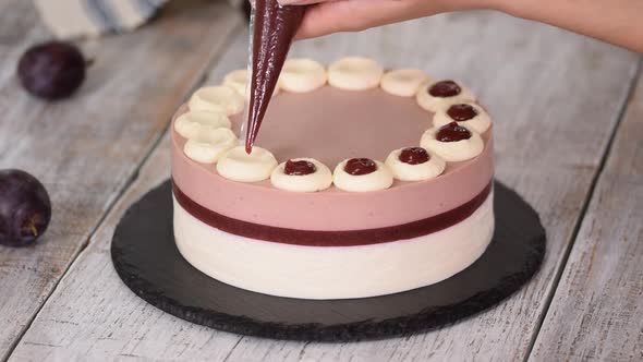 Pastry Chef Decorated a Delicious Plum Mousse Cake with Jam.