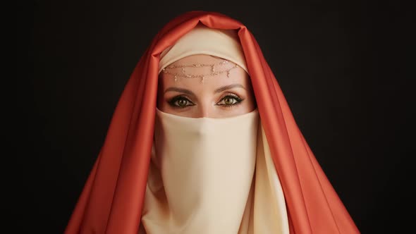 Close Up Portrait Of Beauty Young Muslim Woman In Hijab Looking At Camera.