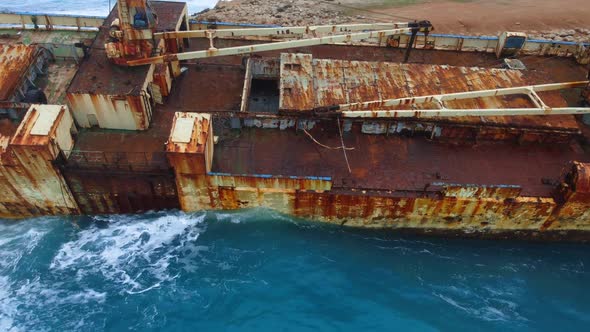 Wreck Sunken Ship in the Sea or Ocean Environmental Disaster Old Rusty Ship in Shallow Water Aerial