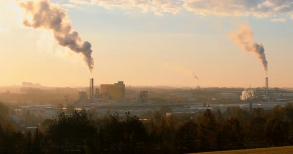 industrial cityscape with with smoking factory