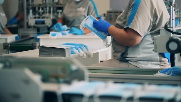 Female Workers Stacking Masks at a Medical Mask Manufacturing Facility