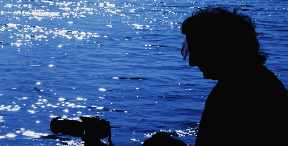 Man Taking Photo near the Sea 2
