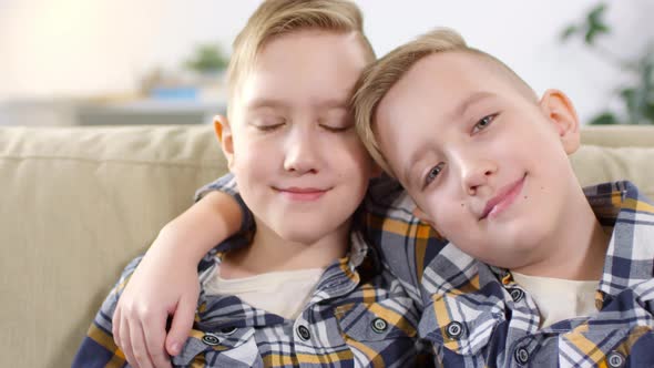 10-Year-Old Caucasian Twins Posing for Camera alt