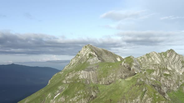 Aerial View Mountain Peak Panorama Flight Surrounded By Cloudy Weather