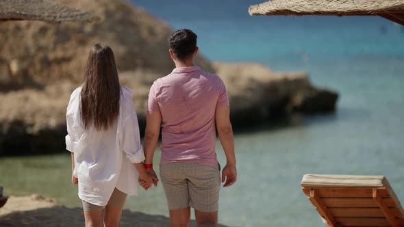 Lovers are Resting on Sea Shore Walking on Beach and Admiring Landscape