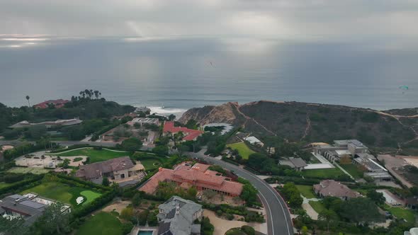 seafront mansions on the hills overlooking pacific ocean in Torrey Pines, San Diego, CA. Aerial pann