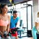Two Attractive Women Exercising with Personal Trainers - VideoHive Item for Sale
