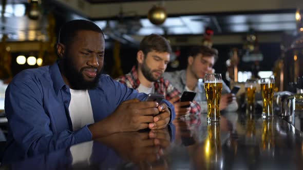 Upset Men Using Cellphones in Bar, Bored Alone on Weekends, Gadget Addiction