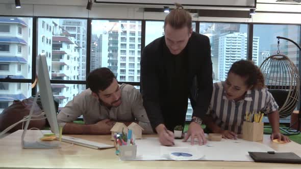 Creative Business People Group Having Conversation at Office Desk in Workplace