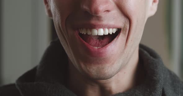 Closeup Portrait Mouth of a Shocked Man with Sudden Good News Rejoices at a Successful Win and Feels