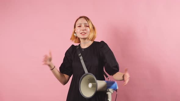 Feminism Concept. Portrait of Young Woman with Loudspeaker, Look at Camera