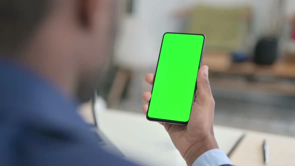 Businessman Using Smartphone with Green Chroma Key Screen
