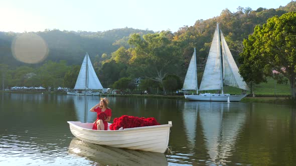 Woman Enjoy Romantic Date on Wooden Boat Sailing at Summer Sunset