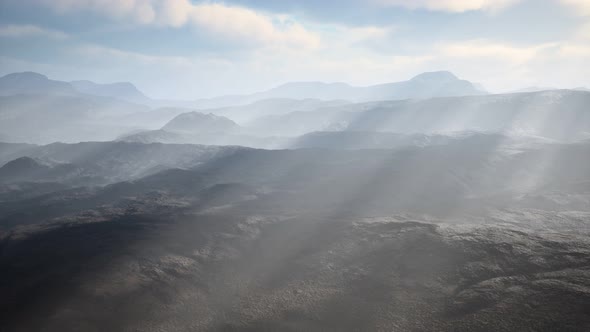 Aerial Vulcanic Desert Landscape with Rays of Light