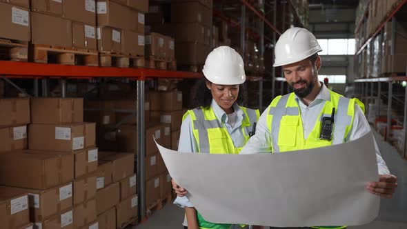 Engineers Working on Plan of Warehouse Renovation