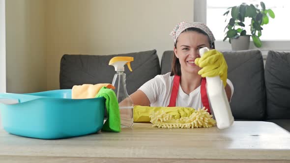 Young Cheerful Housewife is Ready to Start Cleaning