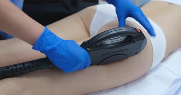 Cosmetologist Removing Unwanted Hair From Client Body Using Laser Closeup  Movie