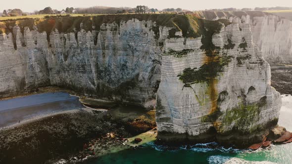 Majestic Aerial Medium Shot View of Epic Famous White Chalk Cliff Seaside Bay Near Sunny Sunset