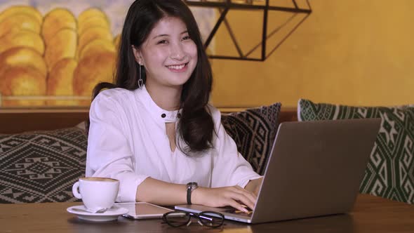 Young Businesswoman Working And Smiling