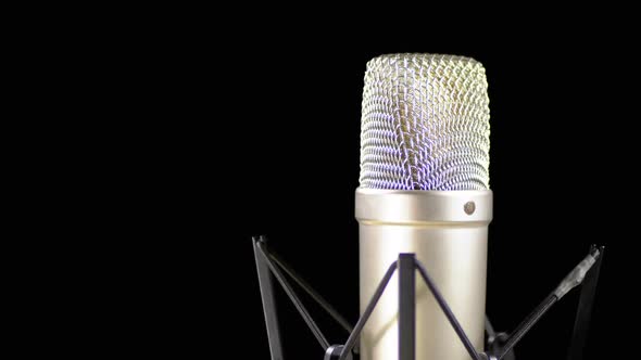 Studio Microphone with Spider Rotates on a Black Background