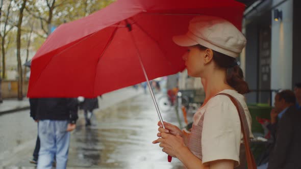 Young girl with a red umbrella