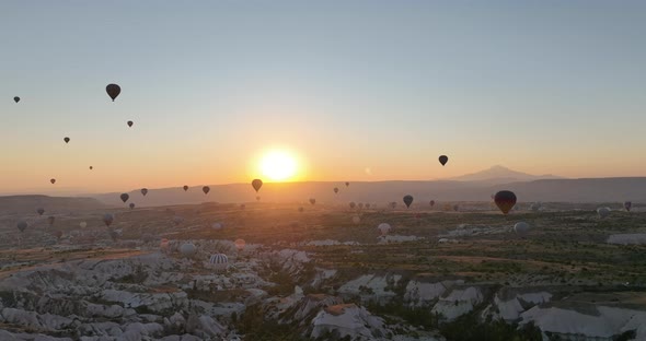 Aerial Cinematic Drone View of Colorful Hot Air Balloon Flying Over Cappadocia