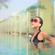 Young asian woman enjoy around outdoor swimming pool for leisure - VideoHive Item for Sale