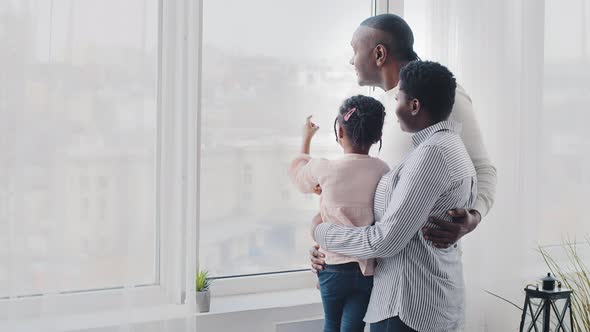 Afro American Happy Family Black Parents Young Mother and Adult Father Hugging Little Daughter Baby