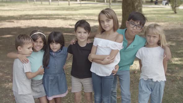 Multiethnic Children Standing Together, Hugging and Smiling