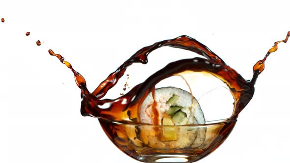 Super Slow Motion Shot of Fresh Sushi Falling Into Soy Sauce Isolated on White at 1000Fps.