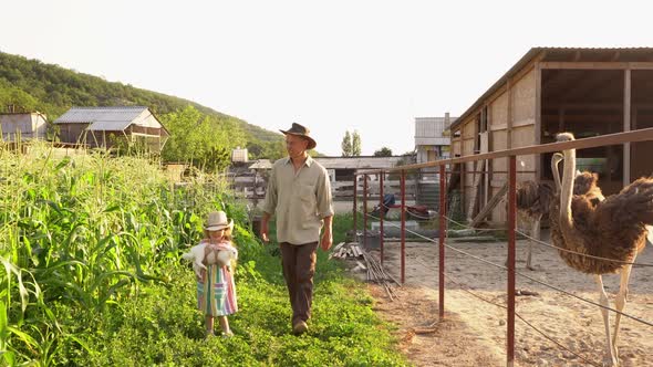 Father and Daughter are Farmers on a Farm