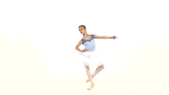 Portrait of the Ballerina in Ballet Pose on White, Slow Motion